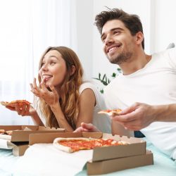 Couple enjoying the finished pizza concept