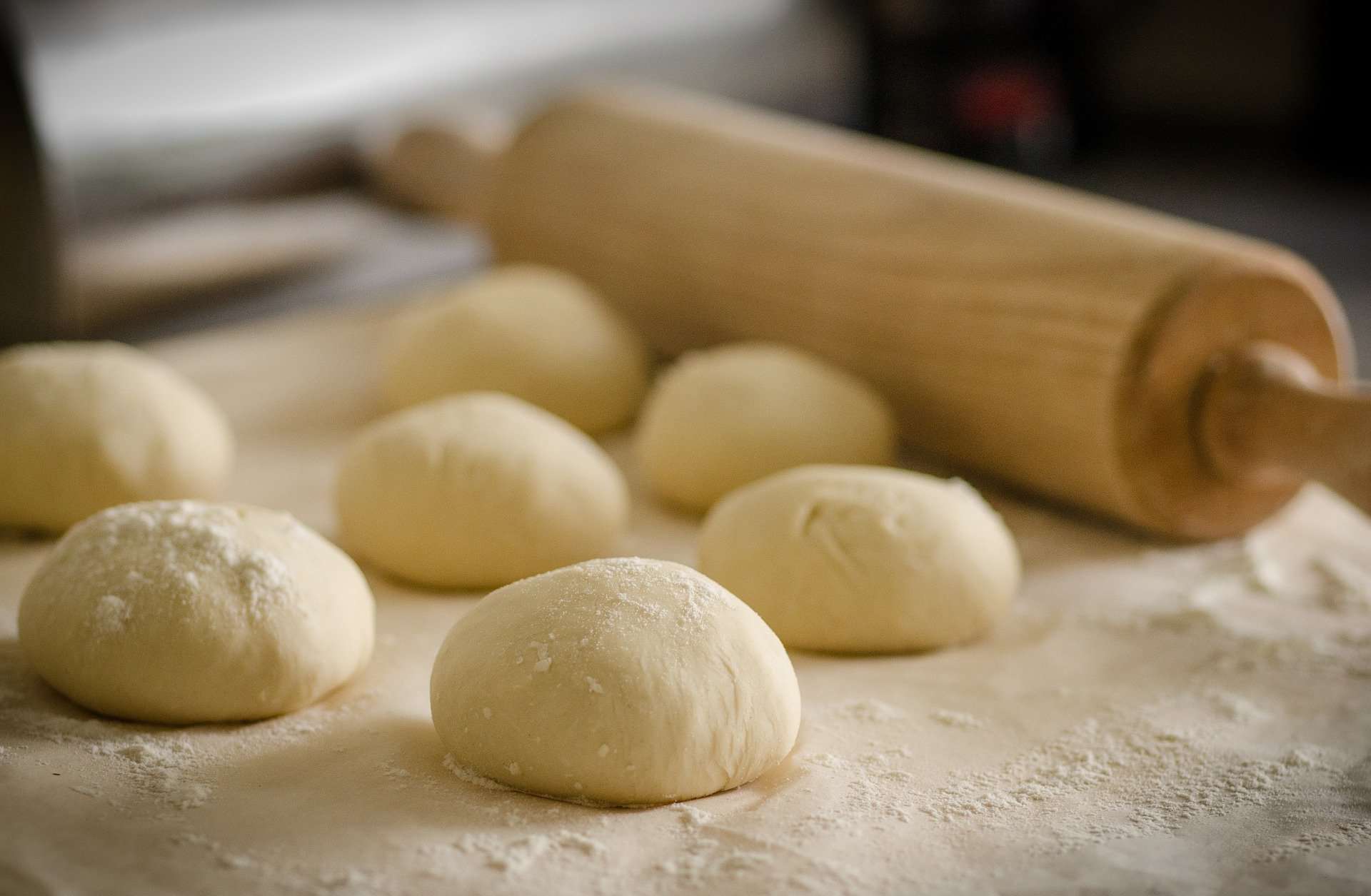Pizza dough preparation with roller